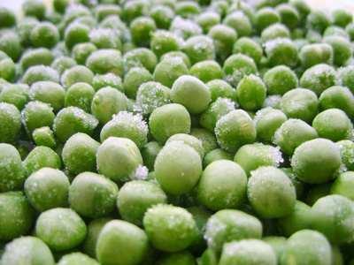 冻的豌豆。豌豆的绿色食品农业清爽的质地照片股票