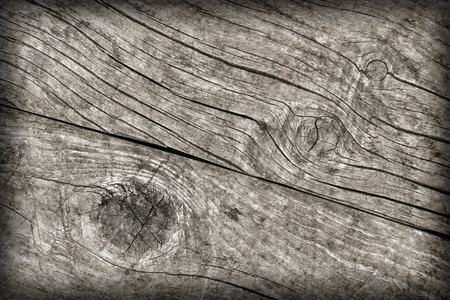 旧的风化的烂的裂纹的打结的粗糙的木头渐晕光 Grunge 纹理