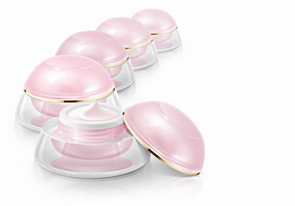 几个粉红色的圆顶在白色背景上的化妆品瓶