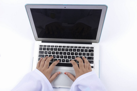 s hand typing on laptop keyboard.