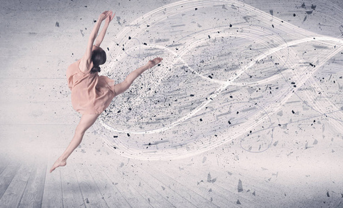 演出的芭蕾舞演员跳起后能量爆炸粒子