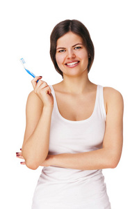 年轻女子微笑拥有健康的牙齿拿着牙刷