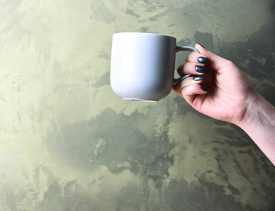 白色茶或咖啡的杯子放在纹理背景