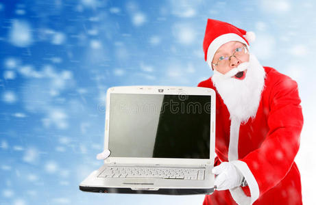 带着笔记本电脑的圣诞老人