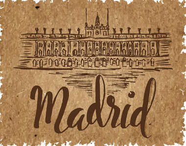 用一只手的马德里标签绘制皇家马德里王宫，刻字马德里在牛皮纸上刻字的笔刷