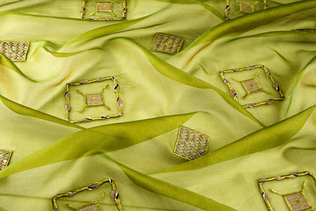 绿色背景豪华型布或波浪褶皱的 grunge 丝绸质地缎天鹅绒
