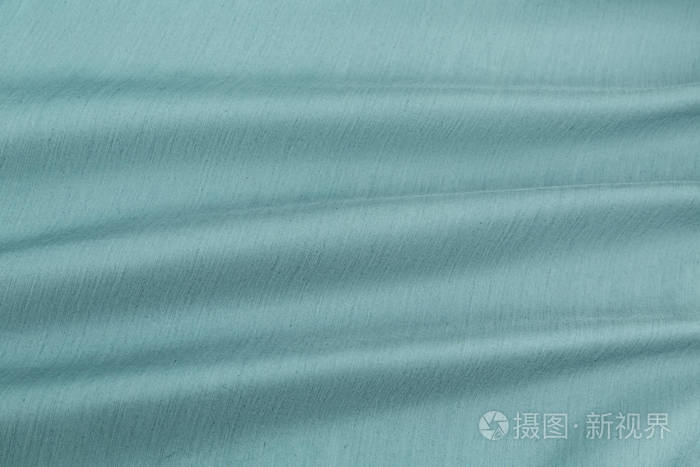 绿松石背景豪华型布或波浪褶皱的grunge丝绸质地缎