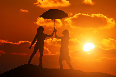 两个女孩的美丽日落控股伞背景剪影