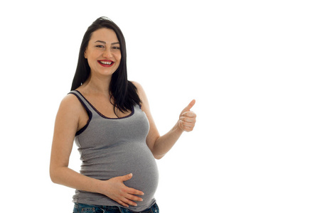 年轻的笑脸孕妇指示的类图片