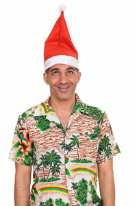戴着圣诞帽的成熟快乐的波斯人图片