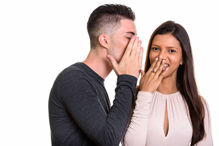 交头接耳而男子交头接耳的女人微笑着对幸福的夫妻照片