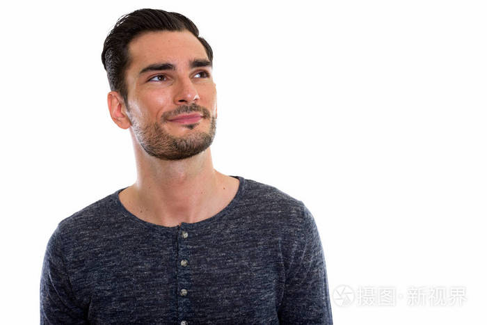 工作室拍摄的年轻英俊的男人抬头的时候在想