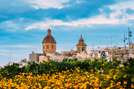 s Church with orange flowers in IlBirgu, Malta