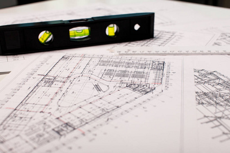 建筑背景。建筑工程 建筑计划 技术项目 绘图技术信件 建筑规划在纸面上，施工计划的一部分