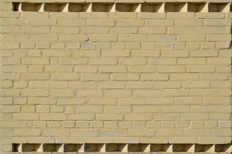 黄墙的质地由各种旧砖和脏砖组成..多个不同尺寸的砖磨破的详细图案