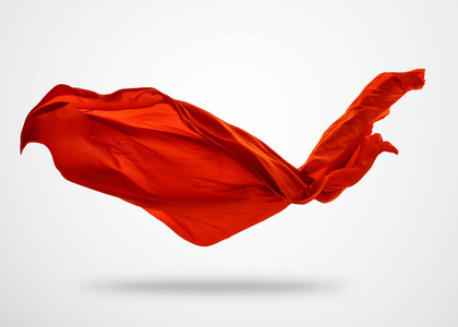 光滑优雅的红布,在灰色的背景上照片