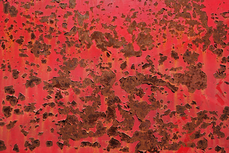 旧红绘的背景生锈的金属表面与旧皮漆照片