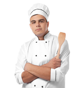 年轻英俊的厨师与刮刀隔离在白色