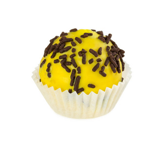 蛋糕的球与黄釉和巧克力粉图片