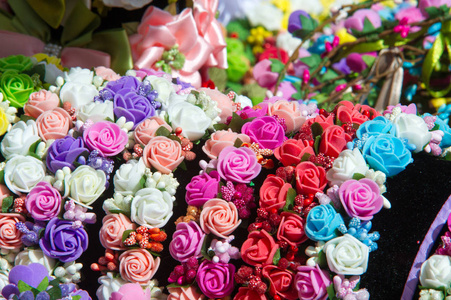 s jewelry made of silk fabric. White and red roses. The plant wi