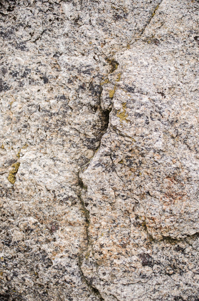 灰色和粒状花岗岩纹理背景.自然的灰色石头的特写镜头