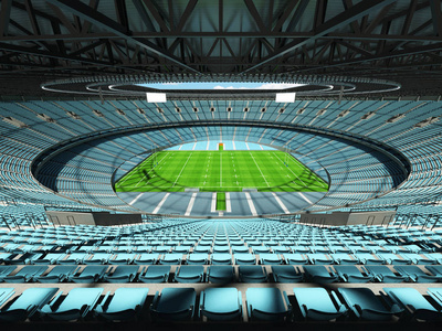 美丽的现代圆橄榄球体育场与天蓝色椅子和 10 万球迷的贵宾包厢