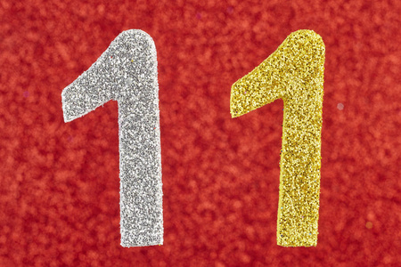 第十一届在红色背景数字十一银黄颜色.周年庆照片