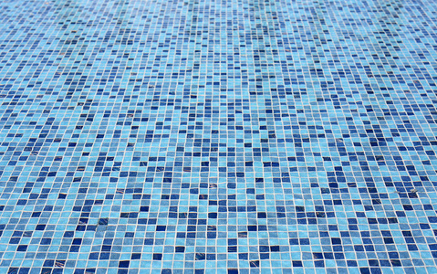 蓝色瓷砖的游泳池背景