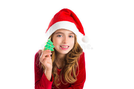 圣诞小女孩拿着圣诞树饼干