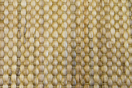 竹编织米色垫手工制作背景