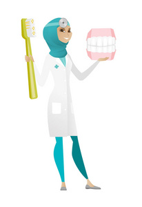 牙医与牙颌模型和牙刷
