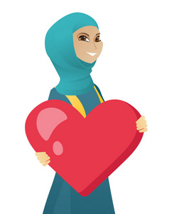 年轻的穆斯林商业女人抱着一个大的心
