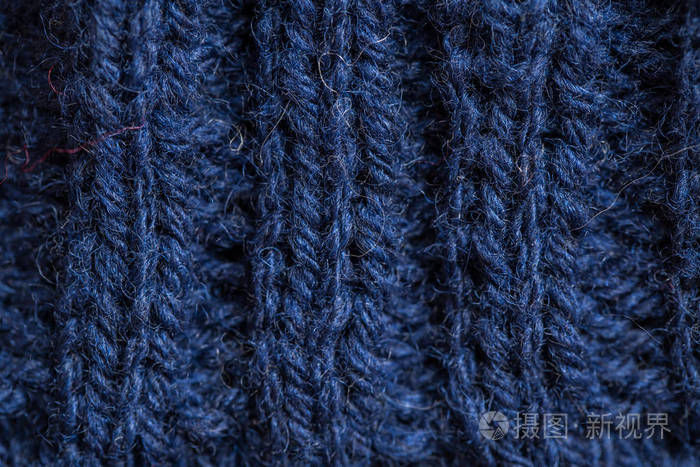 美丽的特写镜头的手温暖和柔软羊毛针织物的模式.