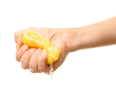 挤柠檬水手挤柠檬的一半照片