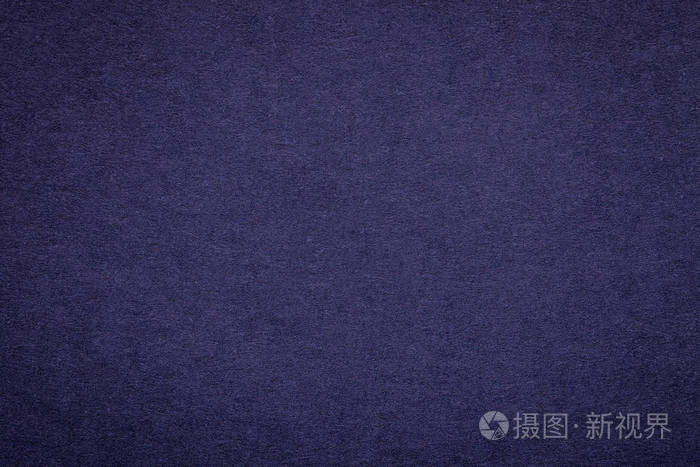老海军蓝色的纸背景,特写的纹理.结构的致密的深色牛仔布纸板