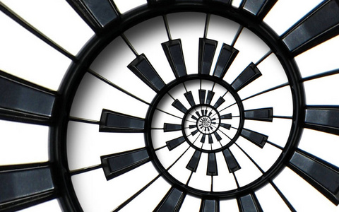 黑色和白色钢琴圆螺旋.螺旋钢琴的螺旋图案抽象背景抽象钢琴螺旋效应.