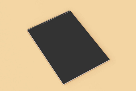 空白的黑色笔记本，与金属螺旋装订上橙色背景