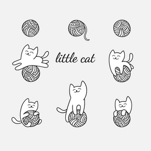 白色的猫玩毛线球照片