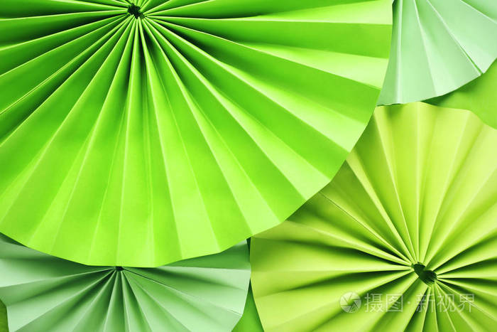 漂亮的绿色纸装饰作为背景