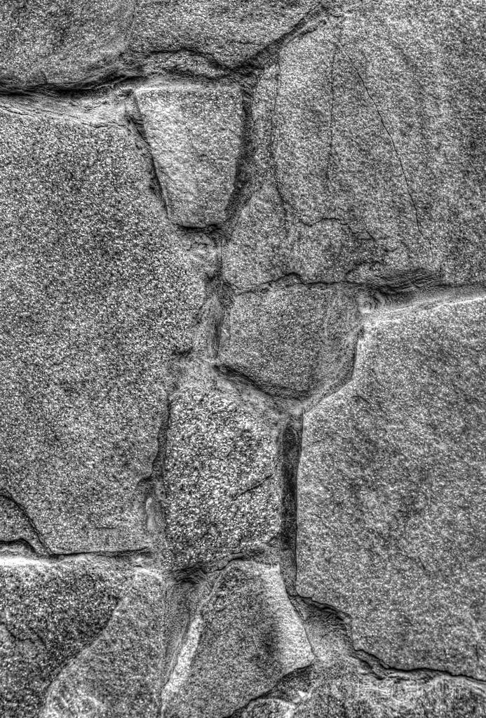 石头墙背景的黑色和白色