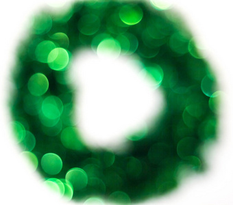 绿色圣诞灯花圈散一个明亮的散背景创造的圣诞灯