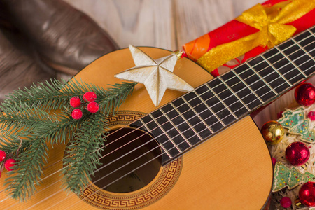 乡村音乐圣诞背景吉他和牛仔靴图片