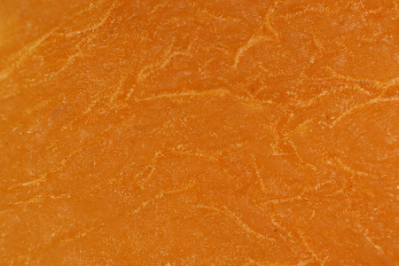 干橙杏仁纹理。温暖的自然有机背景。宏特写镜头