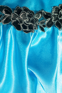 纹理织物背景。 豪华面料或液体波或波浪皱褶丝绸缎纹的抽象背景，天鹅绒材料或豪华圣诞节或优雅的背景。 蓝色蓝色