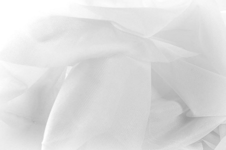 纹理背景图案。 丝绸织物的质地白色。 丝绸织物是透明的。 织物或液体波图，丝缎纹理或天鹅绒材料或白色波浪折痕