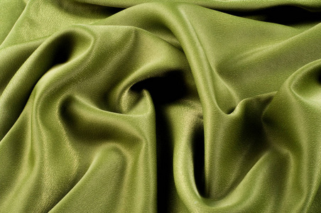 纹理背景。 模板。 布丝绿色绉纹。 丝或类似纤维的细绉。