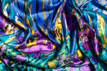 s scarf. Silk fabric is blue, floral pattern. Abstraction