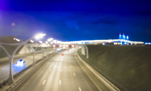 模糊的图像背景夜间高速交通夜间空高速公路上的灯光小径，长期暴露抽象的城市背景