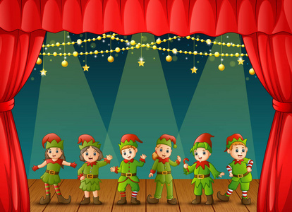 舞台上圣诞精灵表演的矢量插图照片