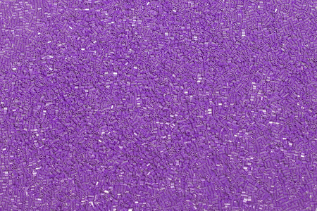 紫色织物亮片。 时尚面料与闪光亮片